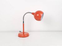 Full view of orange eyeball lamp showing base, gooseneck and shade