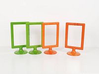 Four Tolsby frames, two green two orange, front view