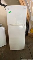 Front view of Magic Chef white top-freezer refrigerator