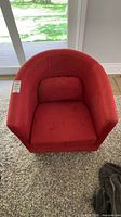 Front top view of red barrel chair showing seat and back cushion
