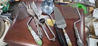 Group view of serving utensils on wood surface