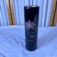 Full view of black lacquer cylindrical vase with floral design