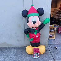 Full view of inflated Mickey Mouse figure with box
