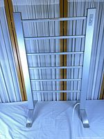 full view of freestanding six-rung towel warmer