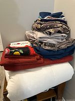 Stacked linens including coverlet, duvet insert and covers