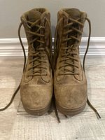 Front view of both boots showing lacing, suede toe condition