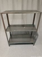 Full view of three-tier metal shelf front