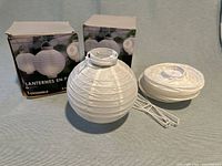 Two Ashland 6-count boxes, one assembled lantern, one collapsed, wire frame visible