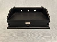 Front view showing drawer and cable openings