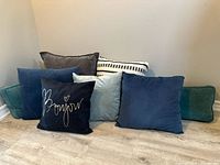 Group shot of all eight pillows showing colors, shapes and fabrics