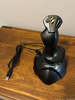 Full view of Thrustmaster USB joystick with attached cable