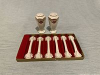 Full set: two shakers and six spoon rests in original felt-lined box