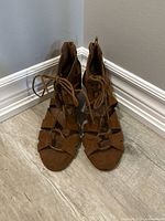 Front view of brown lace-up gladiator wedge sandals