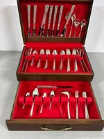 Open chest showing full flatware set in two tiers