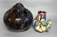 Both ceramic pieces side by side to show scale and condition