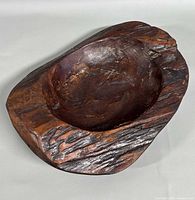 Top view of carved wooden bowl showing interior and textured rim