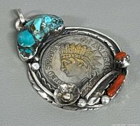 Front view showing coin, turquoise, coral and silver details