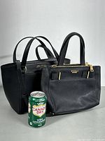 Front view of both handbags showing size comparison