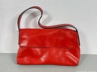 Front view of red leather Francesco Biasia shoulder bag