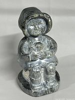 Front view of seated soapstone figure