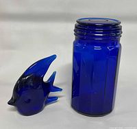 Canister jar and fish figurine front view