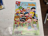 Front cover of Tiny Titans Little Archie and His Pals comic showing characters and logos
