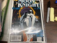 Front cover showing title, issue number, price and imagery, bagged and boarded