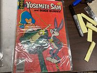 Front cover of bagged Gold Key Yosemite Sam and Bugs Bunny comic issue 61