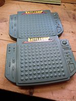 Open Battleship game board showing both peg grids and decal