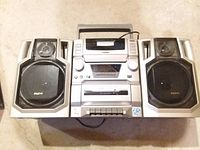 Front view showing entire Sanyo stereo with detachable speakers and control unit