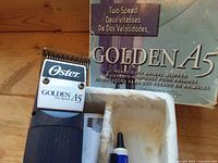 Clipper head with Oster logo and Golden A5 branding next to box