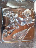 All seven crystal pieces displayed on metal tray