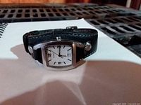 Fossil wristwatch front view showing dial and leather band