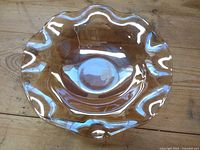 Top view transparent amber scalloped bowl