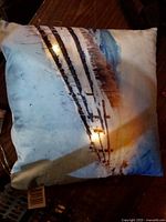 Front of pillow illuminated showing winter scene