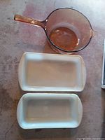 Top view showing two white milk-glass oven dishes