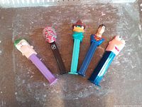 Five character Pez dispensers arranged side by side