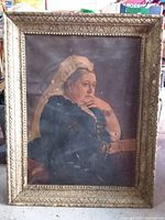 Front view of framed portrait showing Queen Victoria and ornate frame