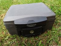 Front view of SentrySafe lockbox safe showing latch, logo, and overall exterior