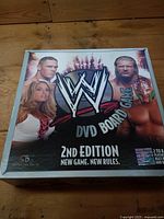 Closed box top displaying WWE DVD Board Game 2nd Edition graphics and branding