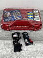 Overall view of Battery Daddy case with batteries and two testers