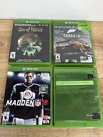 Front covers of three Xbox One games and reverse cover of one game