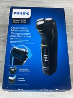 Front of box showing Philips Shaver 3000 features