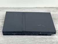 Top view of black PlayStation 2 slim console