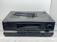 Front angled view of Technics SA-G76 receiver showing overall condition and top ventilation panel