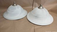 Pair of Canarm flush mount lights showing overall design and glass shades