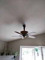 Fan installed on ceiling showing overall appearance and blade style