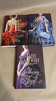 Group shot of the three Mary Balogh hardcover books