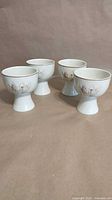 Group of four Royal Doulton Lambethware Thistledown goblets