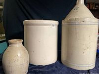 Group shot of jug, open crock and small jar showing design, size comparison and condition issues